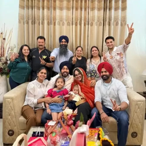 Abhishek Sharma posing with his family members during a celebration at home