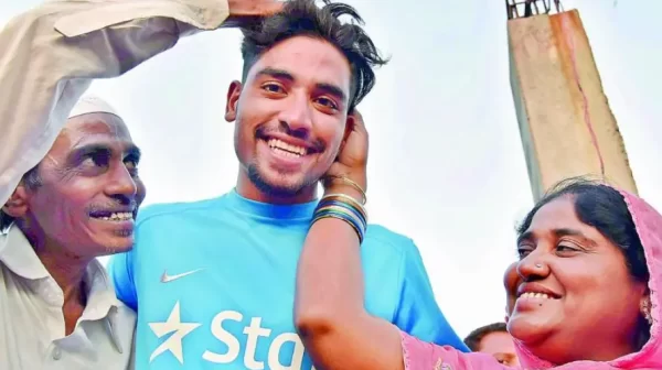 Young Mohammed Siraj smiling with his parents during the early years of his cricket journey in Hyderabad.