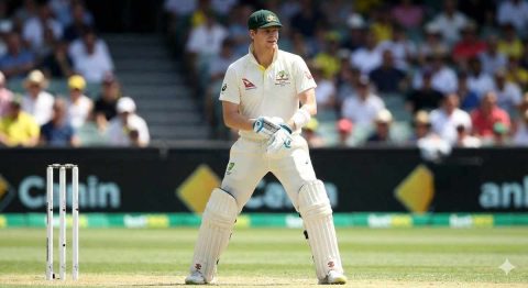 Steve Smith standing ready in his Australian whites, currently ranked 6th on the all-time list for Highest Centuries in Test Cricket. With 36 centuries and over 10,000 runs, he is one of the top active players with the most centuries in test cricket.